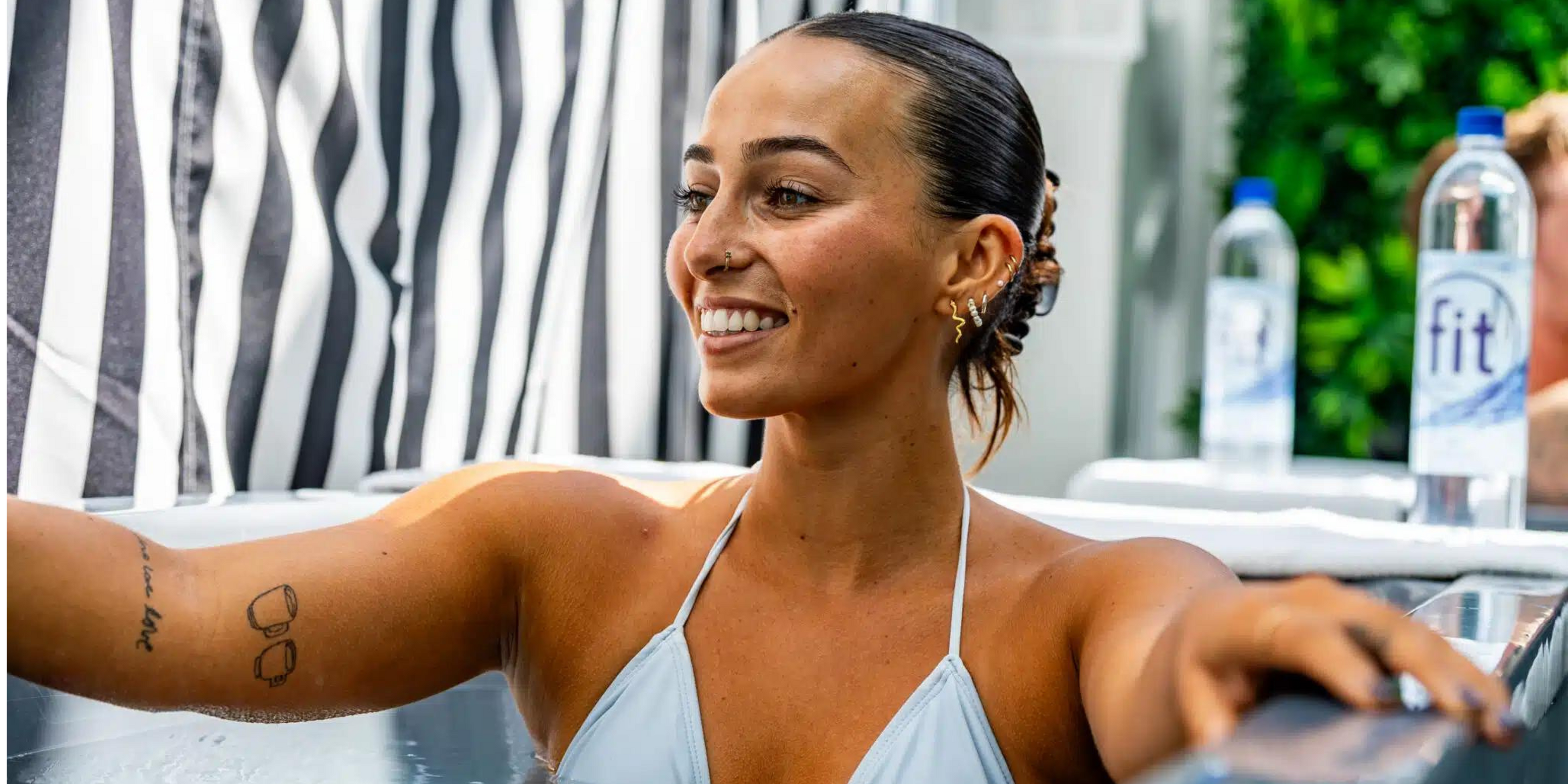 Female athlete in enjoying the commercial eternity cold plunge tub
