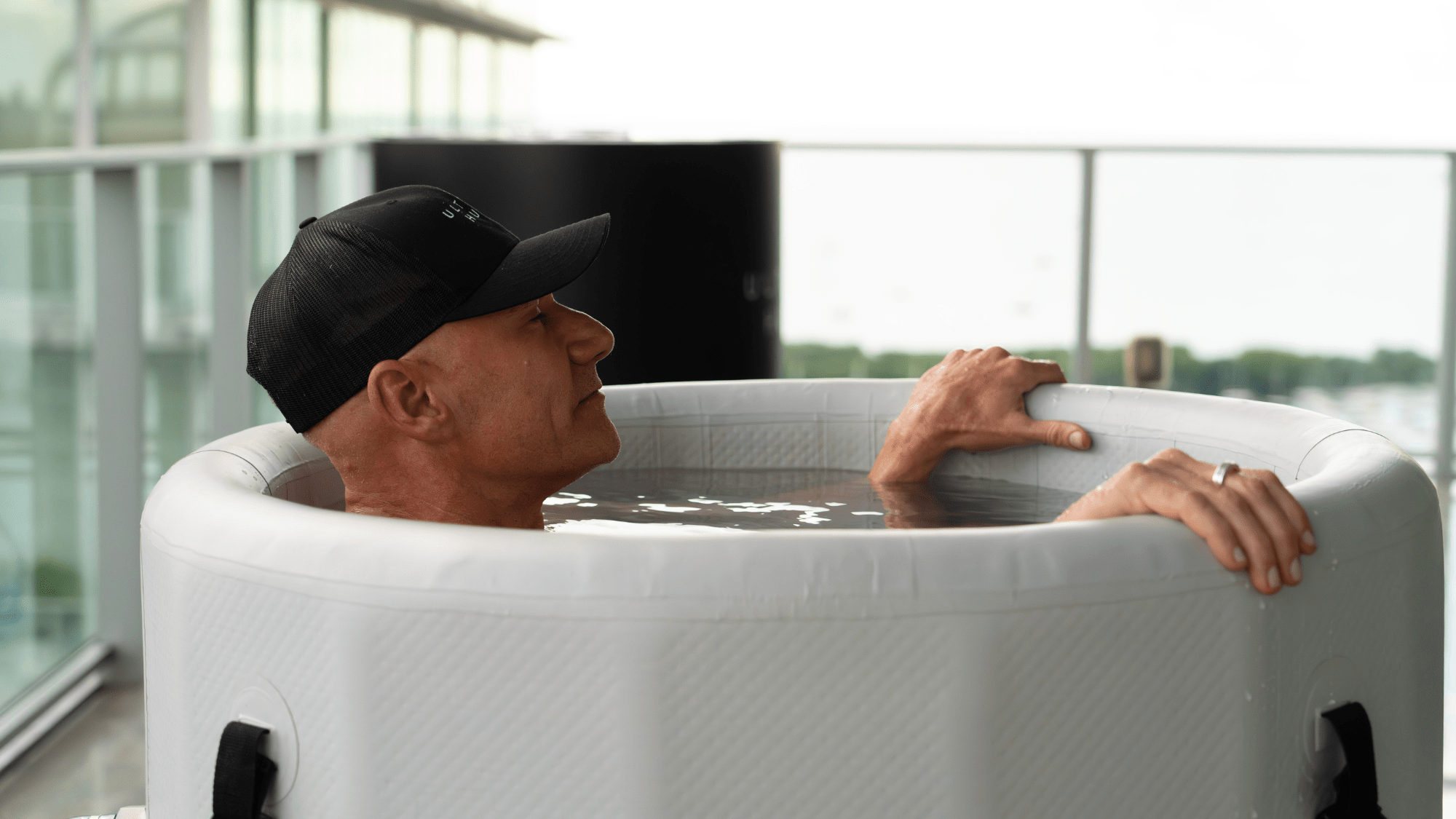 Man enjoying inflatable cold plunge
